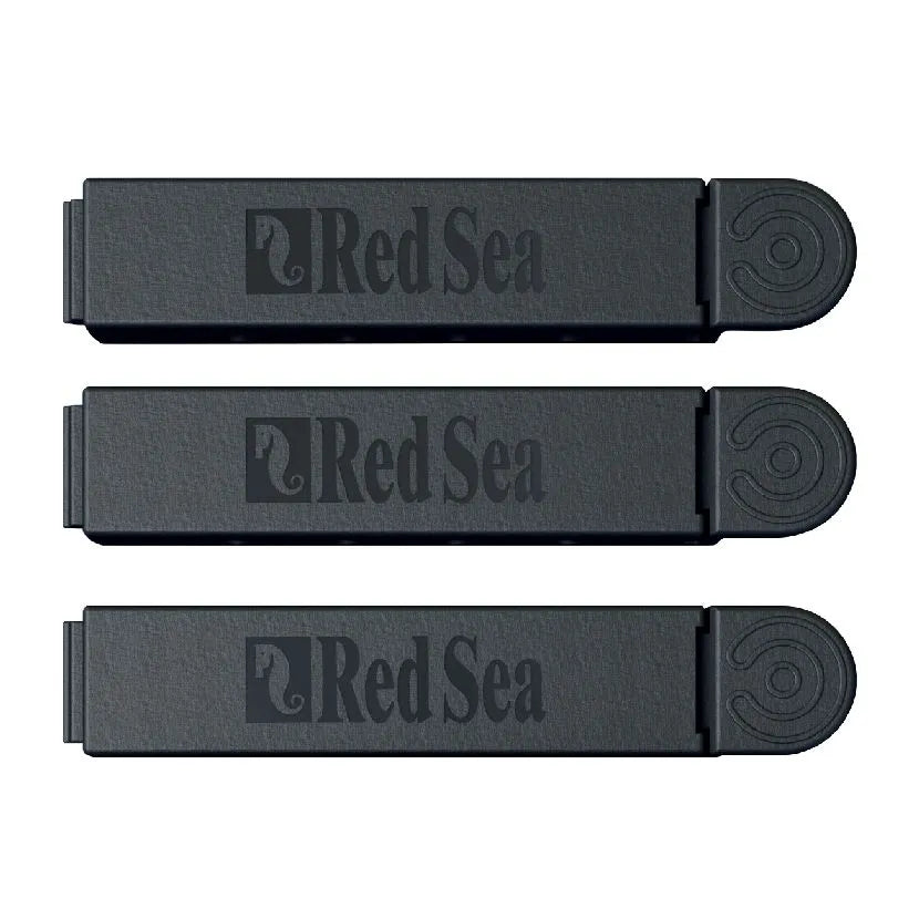 Three black Red Sea brand products on a white background