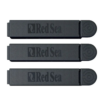 Three black Red Sea brand products on a white background