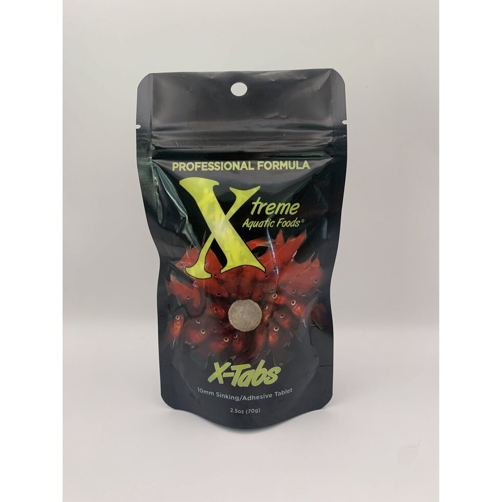 Xtreme X-Tabs tablets pressed on aquarium glass