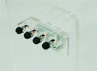 Seaside Aquatics Magnetic Probe Holder, clear acrylic magnet-mount block gripping four aquarium probes through angled ports