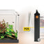Fluval P25 nano heater shown beside a dime for scale next to a small planted aquarium