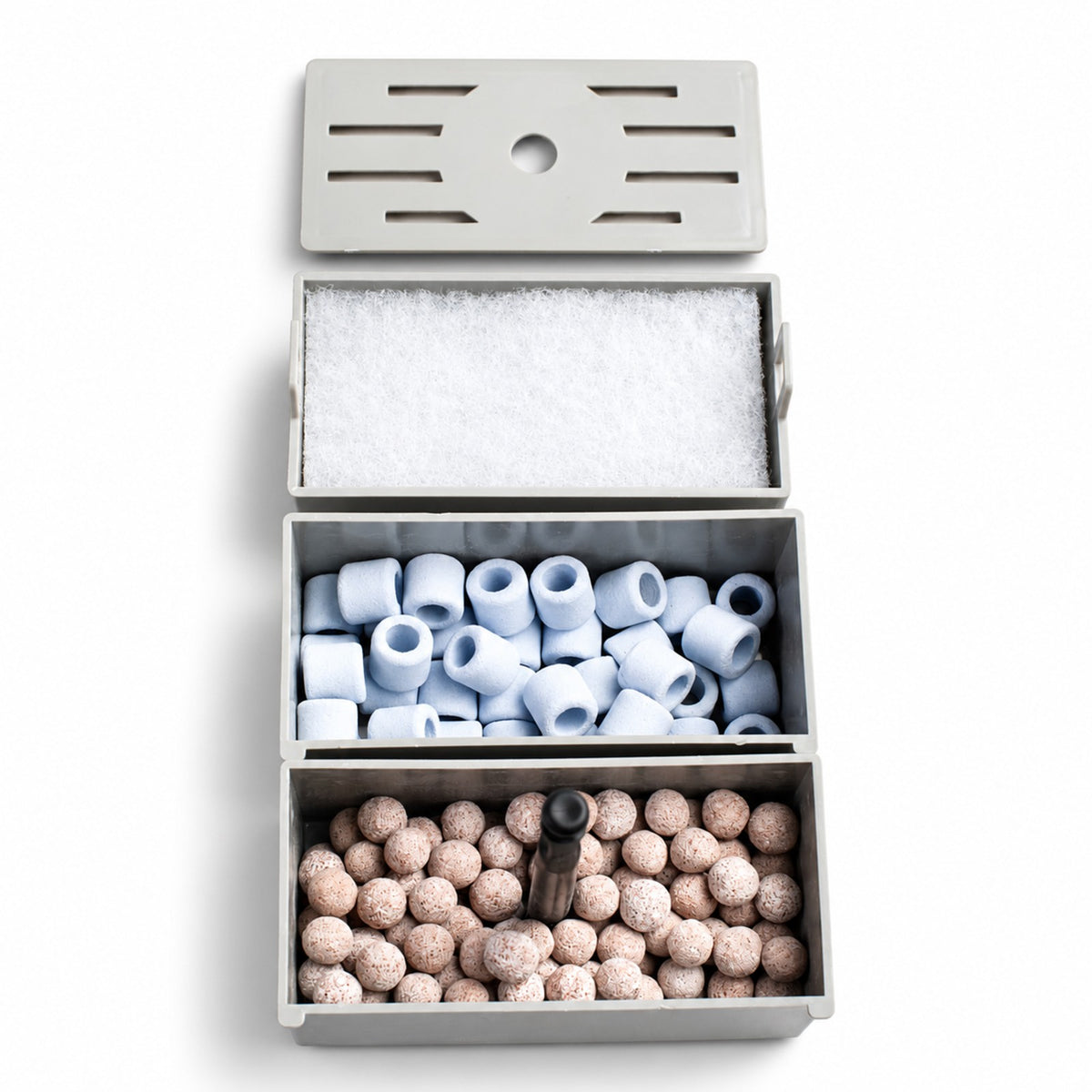 All three AquaFin filtration boxes stacked: filter pad on top, ceramic rings in the middle, bio balls at the bottom