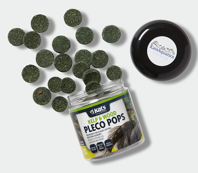 Kelp and Wood Pleco Pops sinking wafers scattered around the open jar