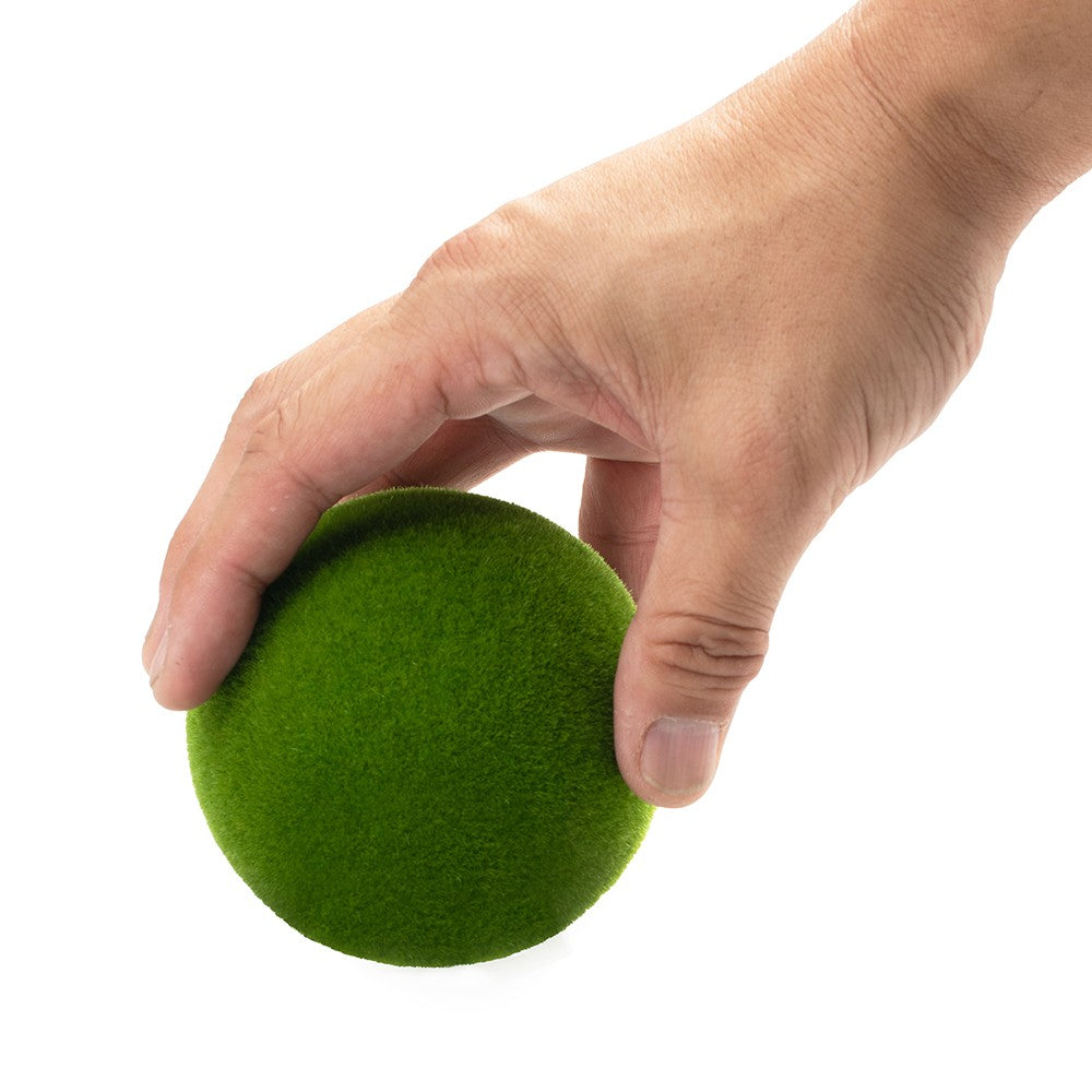Aquatop Moss Ball Safe House Medium held in a hand, showing its scale