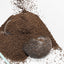 A Controbase mesh bag part buried under a mound of aquasoil in a tank corner