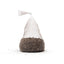 A single tied mesh bag of UNS Controbase sitting on loose granules