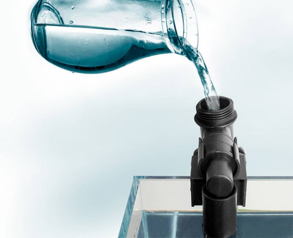 Water being poured into the Aquatop CF MKII canister filter intake valve