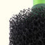 Close-up of the coarse black filter sponge showing the open pore structure
