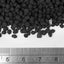 UNS Controsoil black fine granules beside a ruler, roughly 3 mm across