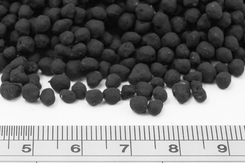 UNS Controsoil black normal granules beside a ruler showing the granule size