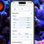 Red Sea ReefBeat app showing the ReefControl dashboard with live pH, temperature, salinity, ORP, leak, and ATO readings over a reef aquarium