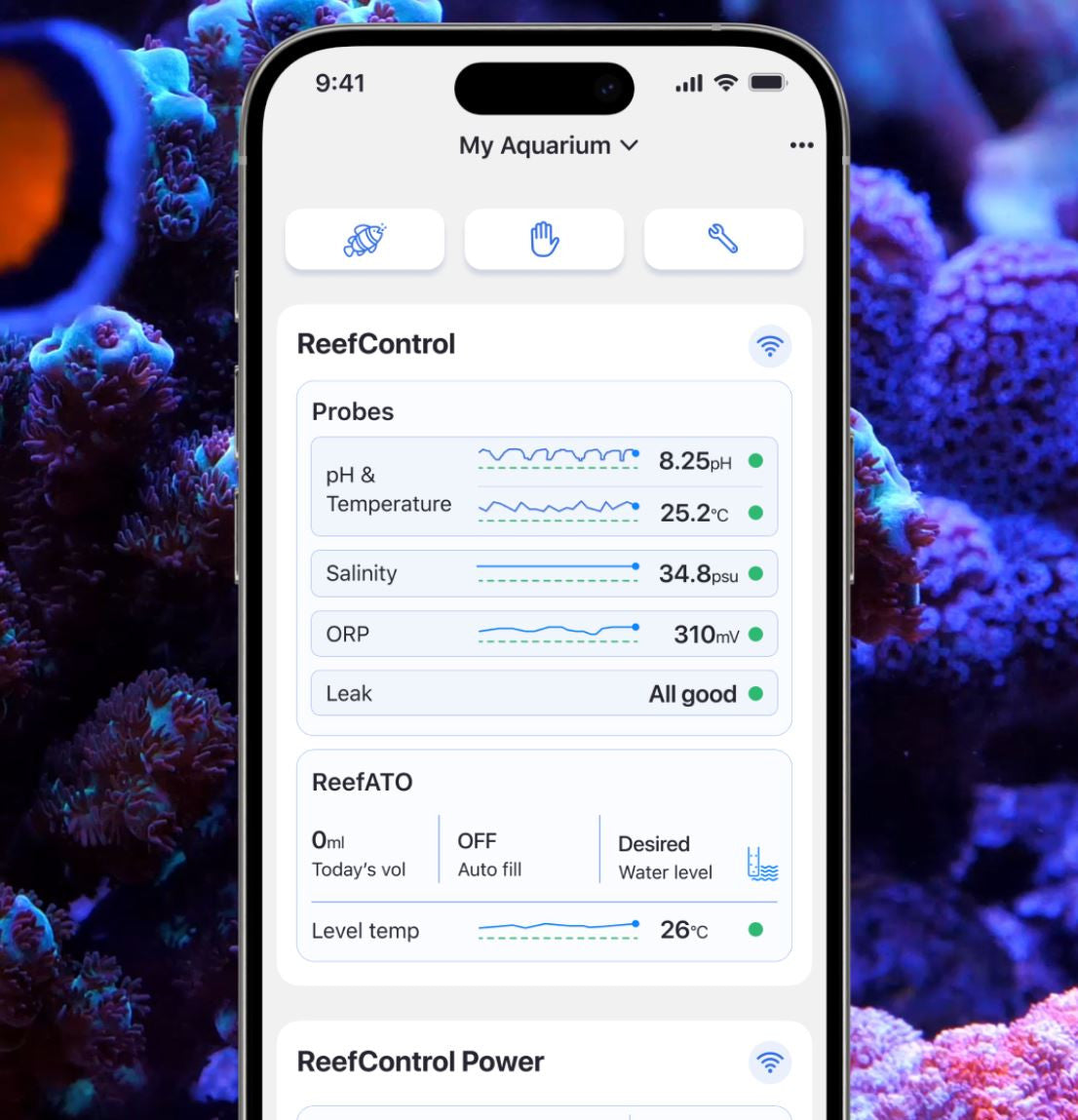 Red Sea ReefBeat app showing the ReefControl dashboard with live pH, temperature, salinity, ORP, leak, and ATO readings over a reef aquarium