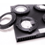 Illumagic X4 with interchangeable lens rings removed, showing the LED clusters and spec label