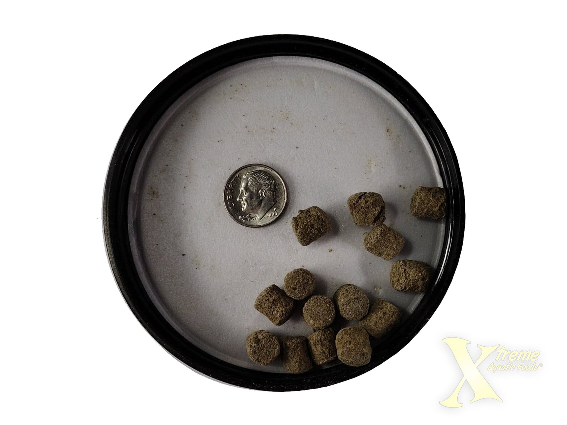 Xtreme Aquatic Foods Monster 9mm sinking pellets shown with a dime for size comparison