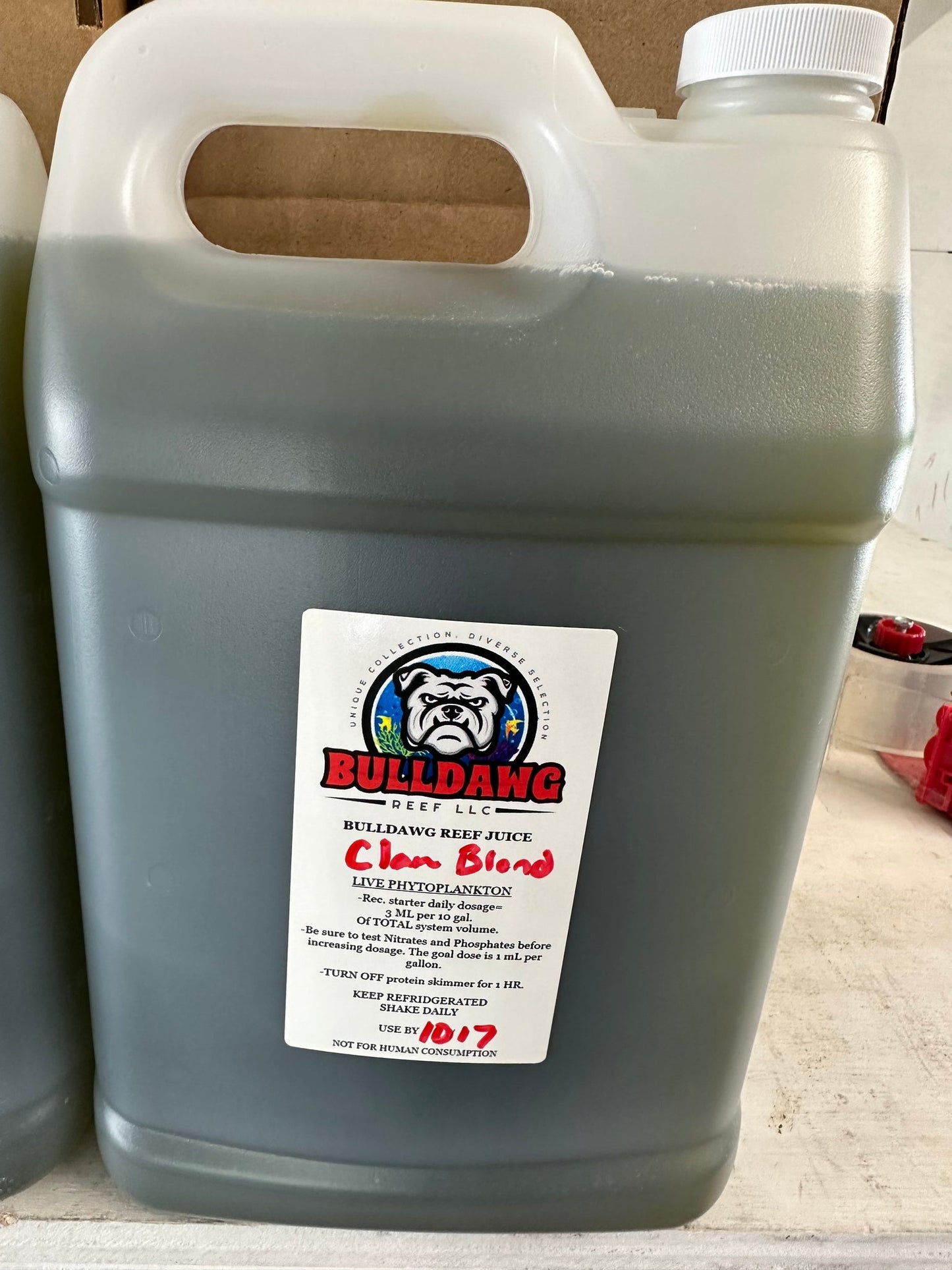 Bulldawg Reef Juice Clam Blend bottle - multi-species live phytoplankton for clams and saltwater filter feeders
