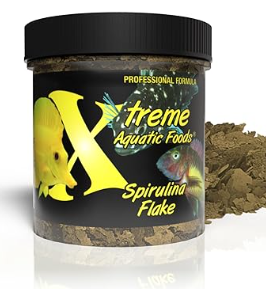 Xtreme Spirulina Flake jar with olive-green flakes poured beside it on a white background