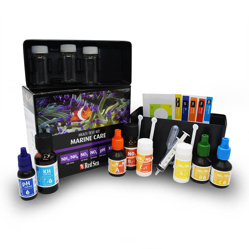 Red Sea MCP Test Kit contents - reagent bottles, glass vials, and syringes for saltwater reef aquarium testing