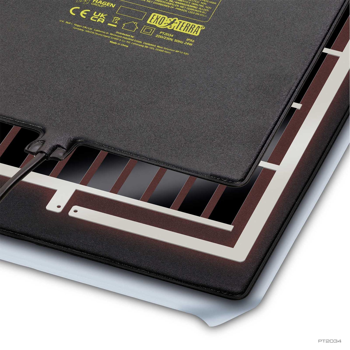 Close-up of the Exo Terra PTC Heat Mat back showing the internal heating element and printed specifications