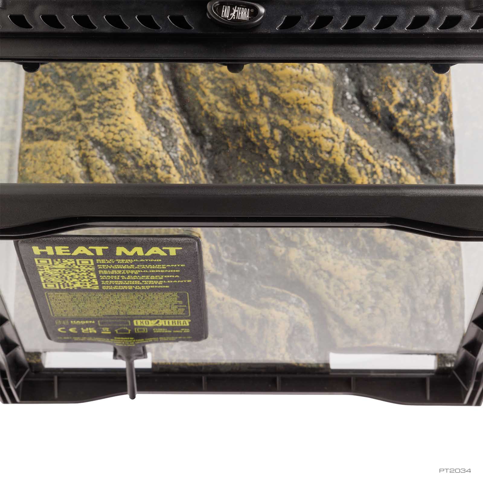 Exo Terra PTC Heat Mat mounted on the outside glass of a reptile terrarium