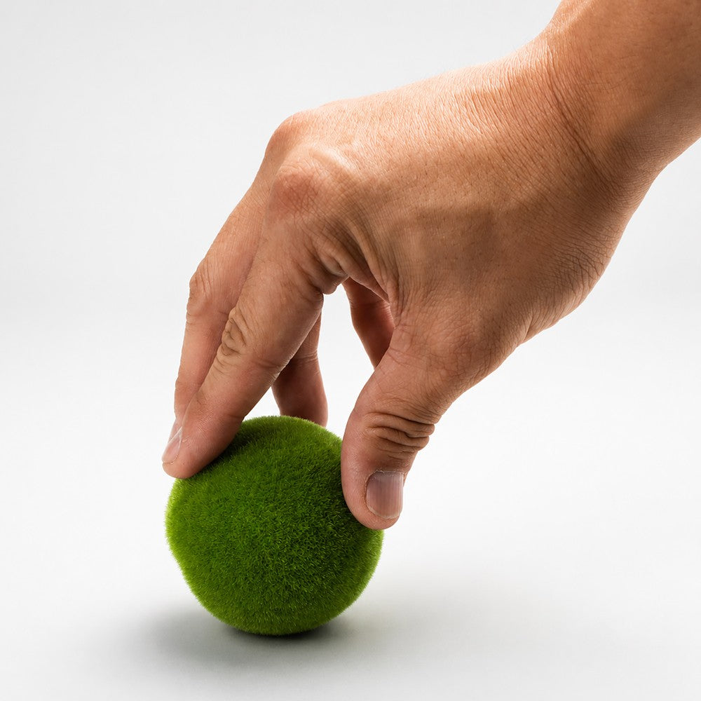 Aquatop Moss Ball Safe House Small held in a hand, showing its scale